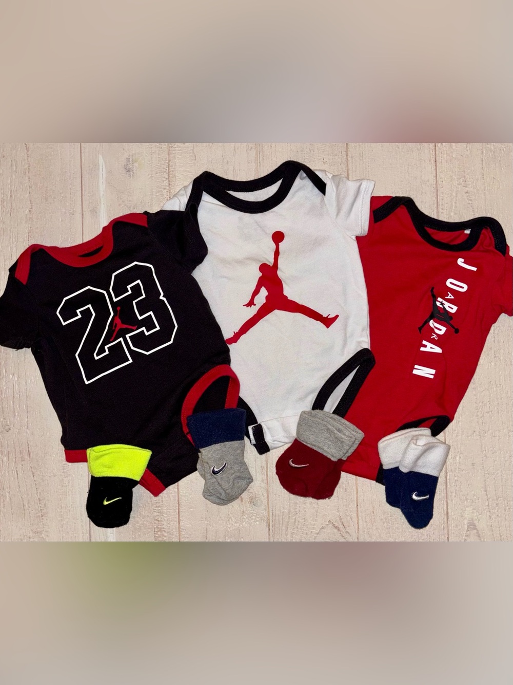 Jordan Infant 3-Pack One-Piece Bodysuits in Black, White & Red w/ Matching Socks